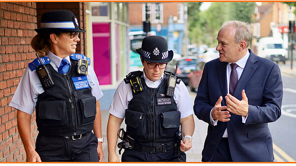 Ed Davey talking to Police officers