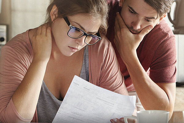 Couple looking at an energy bill